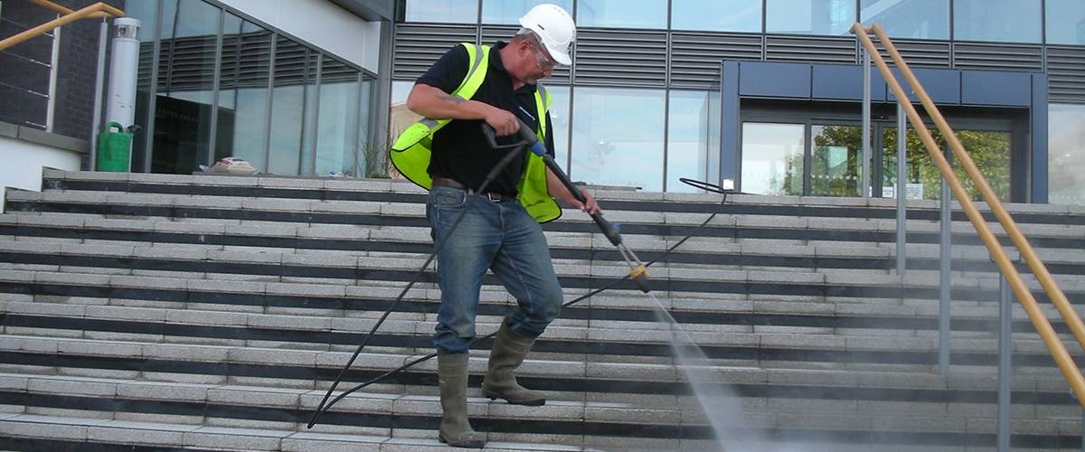 Power Clean operator cleaning a commercial entrance